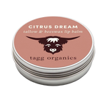 Lip balm container with 'Citrus Dream' and 'tagg organics' branding on a white background