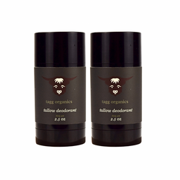 Two tallow deodorant containers from tagg organics on a white background