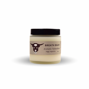 Jar of breath balm with a black lid on a white background