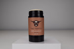 Deodorant stick with a brown label featuring a logo on a gray background