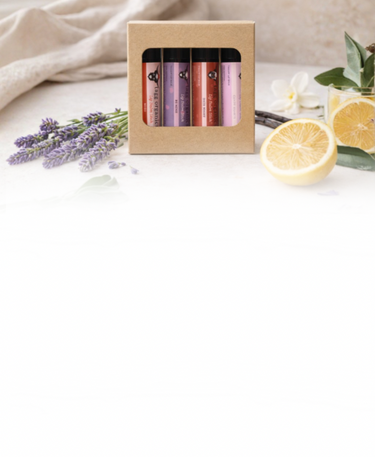 Set of lip balms in a cardboard box with lavender and lemons on a light background