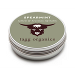 Lip balm container with spearmint flavor and tagg organics branding on a white background