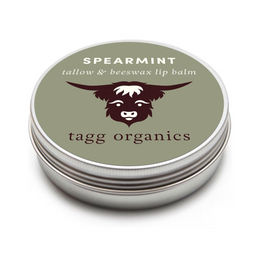 Lip balm container with spearmint flavor and tagg organics branding on a white background