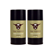 Two tallow deodorant sticks by tagg organics on a white background