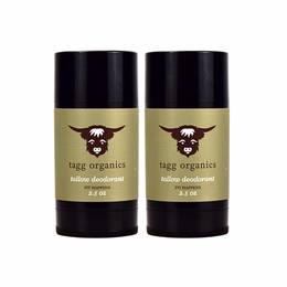 Two tallow deodorant sticks by tagg organics on a white background