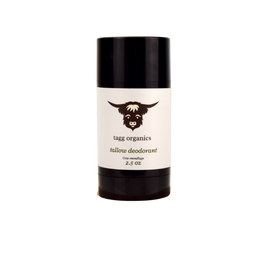 Deodorant stick with black cap and white label featuring a logo and text on a white background