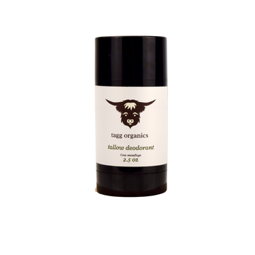 Deodorant stick with black cap and white label featuring a logo and text on a white background