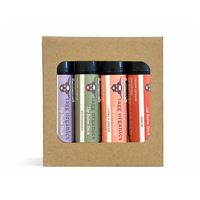 Set of four lip balm sticks in a cardboard packaging with visible brand name.